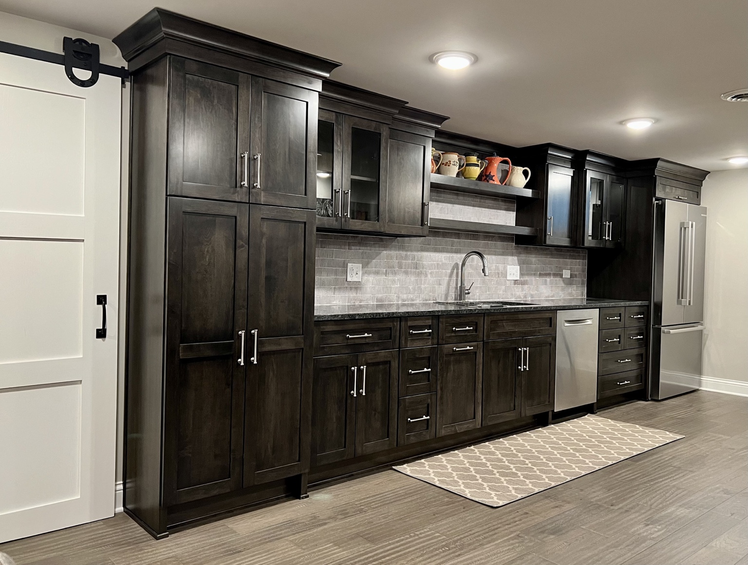 Custom dark-stained cabinetry and built-in storage