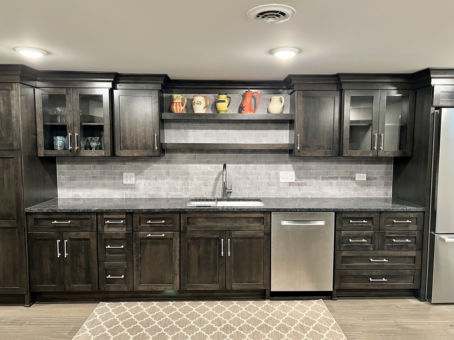 Custom built-in cabinetry with detailed storage and millwork
