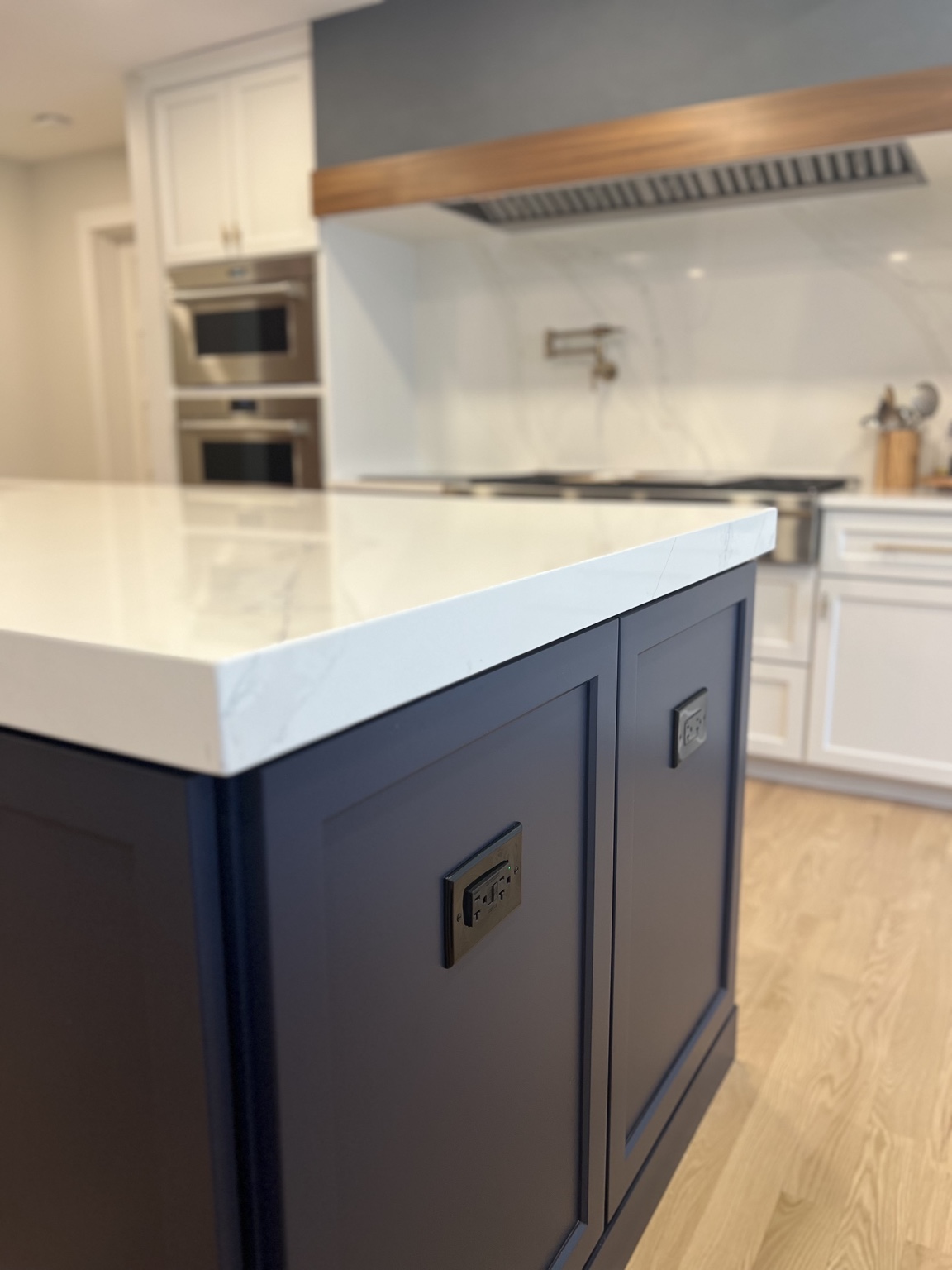 Navy kitchen island and quartz countertop detail
