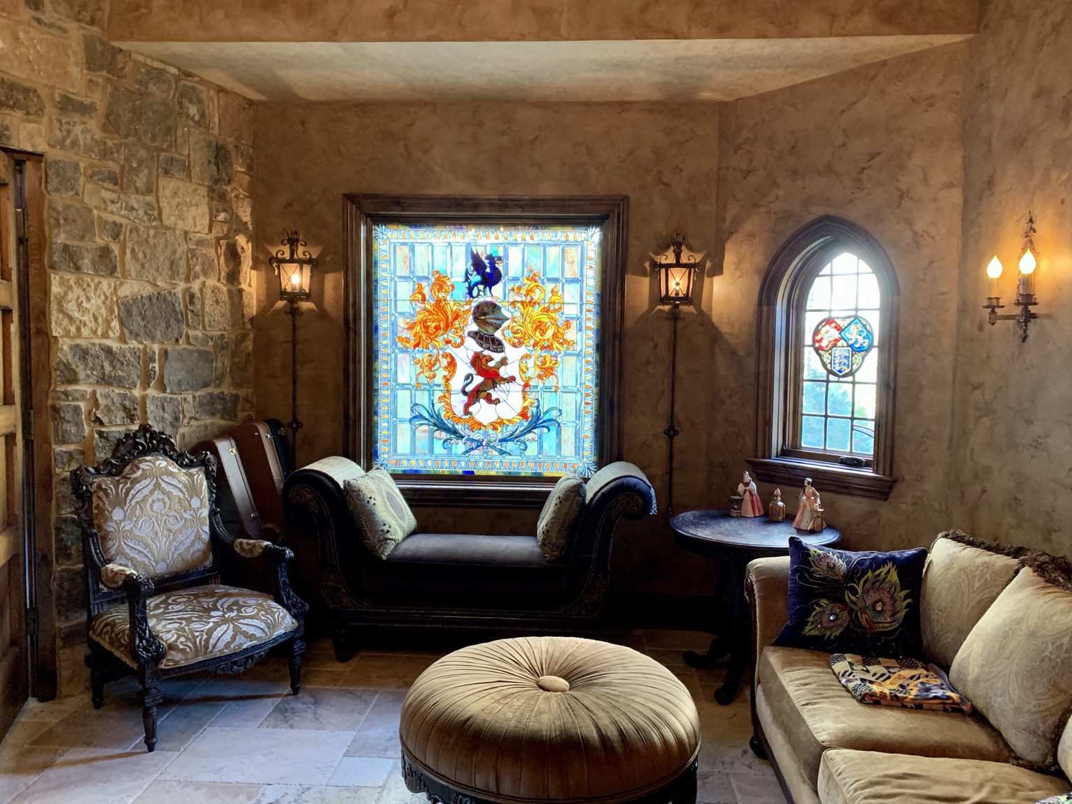 Sitting room with custom stained glass, natural stone and detailed wood trim.