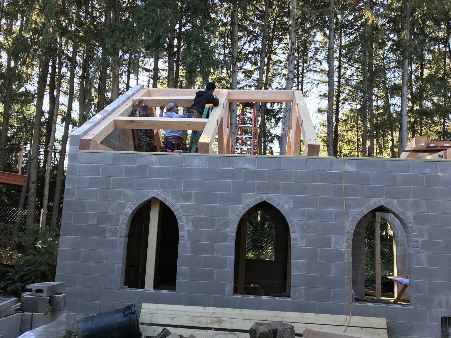 Craftsmen framing the timber roof structure of an outdoor pavilion in Naperville.
