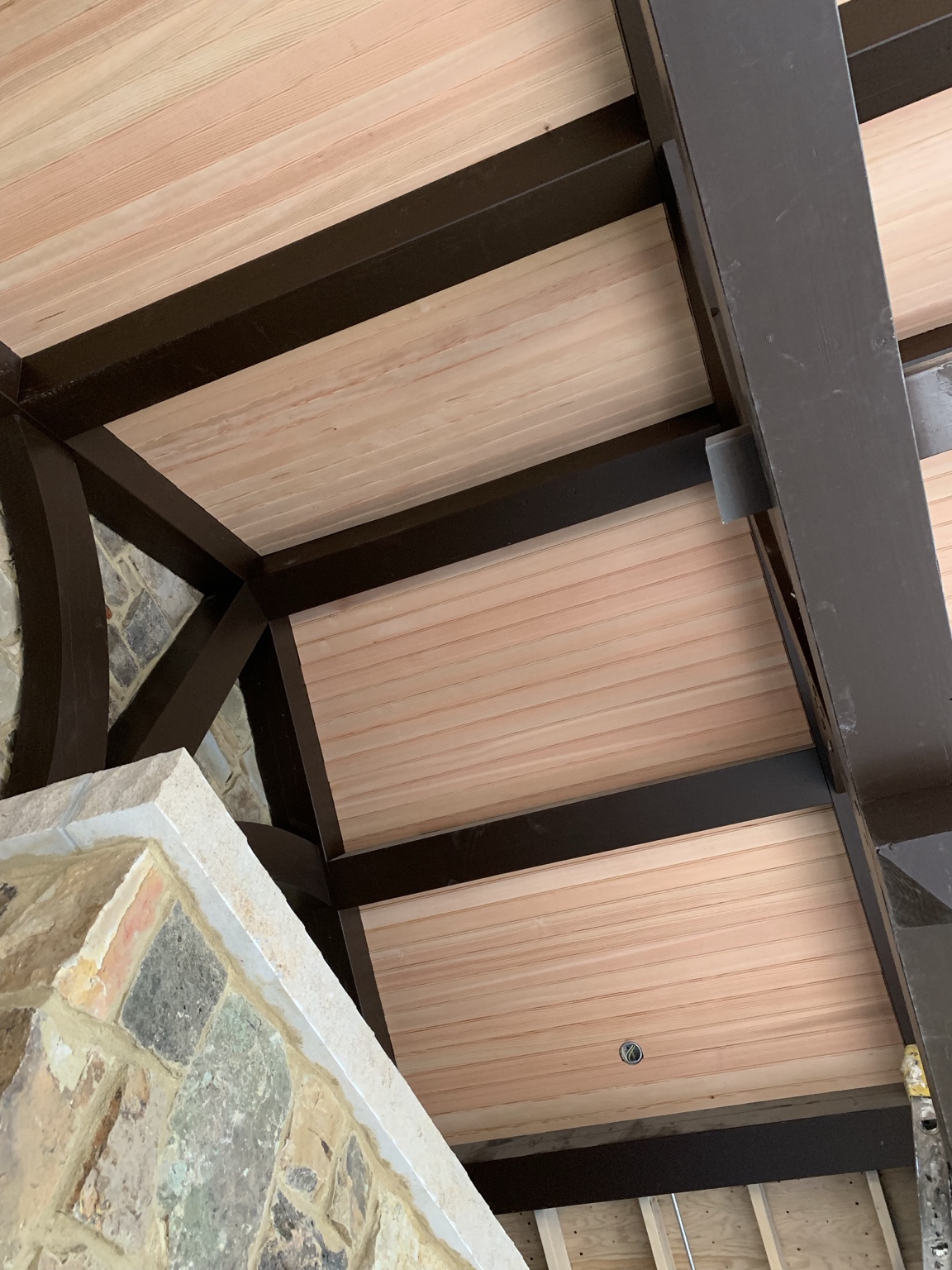 Timber beam and wood ceiling detail at the completed outdoor pavilion.