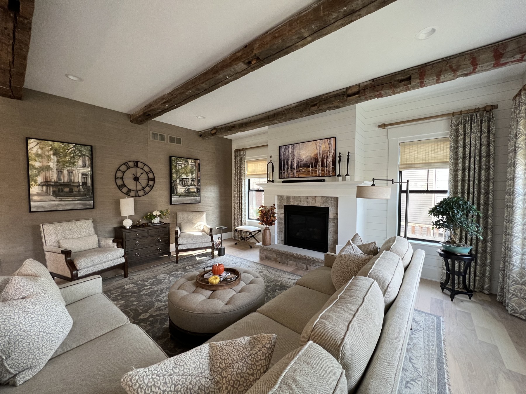 Family room with reclaimed beams and stone fireplace